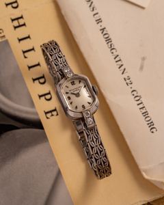 White-gold Patek Philippe for the ladies. The beautiful tonneau shaped case is only enhanced by…